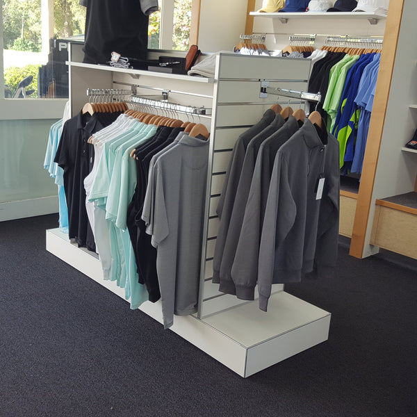 Plankwall Double Plinth G60 Gondola in white shown stocked with apparel in a retail store
