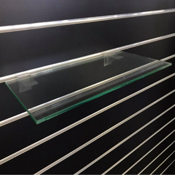 Plankwall single Glass Shelf shown against black slatwall background with acrylic bracket.
