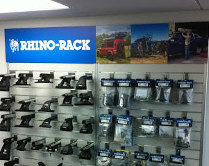 2x Plankwall light free standing display panels in White in retail space with stock