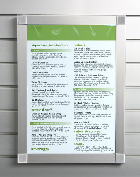 A  Plankwall aluminium menu snap frame displaying a menu on a slatwall wall panel. 