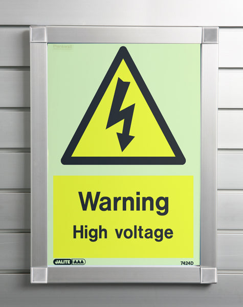 A  Plankwall aluminium snap frame displaying a warning sign at a business mounted on a slatwall wall panel. 