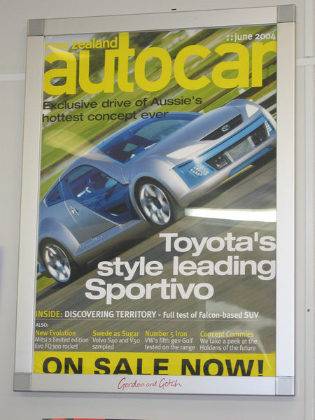 A  Plankwall aluminium snap frame  displaying a magazine cover.