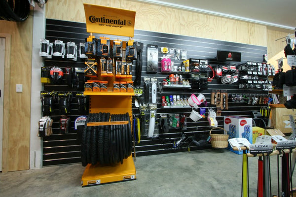 Cycle accessories on black slatwall wall panel