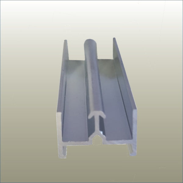 close up photo of the Plankwall anodised aluminium door track component. Designed to work with a black door track filler, both components are designed to hold sliding doors in place on a flat surface.