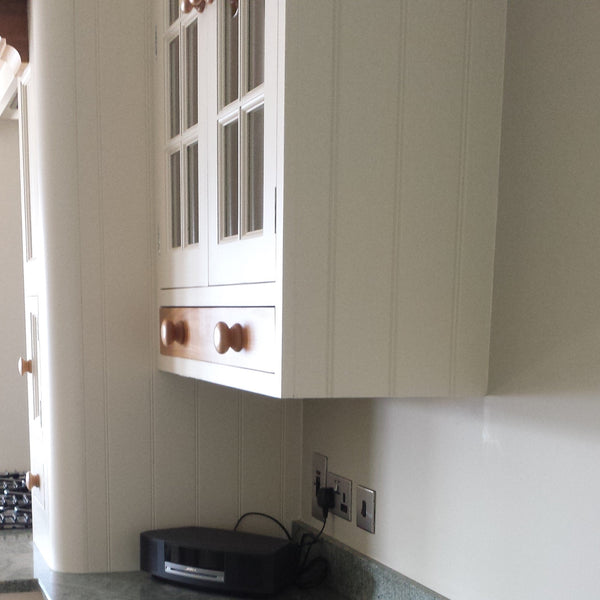 Detail of kitchen cabinetry using Plankwall W grooved Panels painted white
