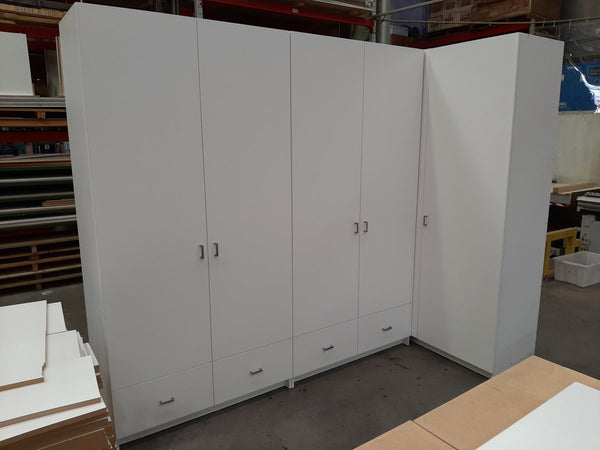 White storage cabinets in a warehouse setting