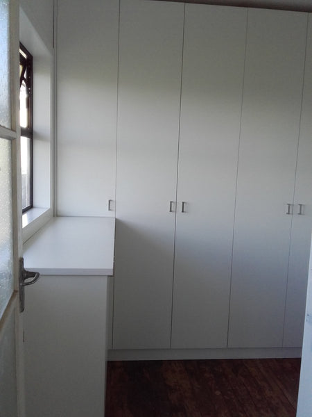 Custom in built white wall storage cabinets