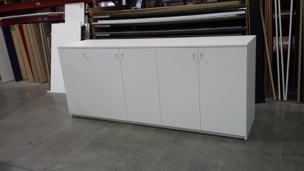 Custom Requests: white storage cabinets in a factory setting