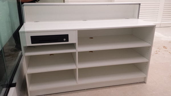 Custom Retail counter showing shelves and lockable door on back