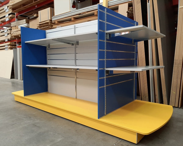 a Plankwall bespoke coloured gondola in blue and yellow in a factory setting