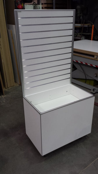 Custom retail unit: slatwall display panel with display bin underneath