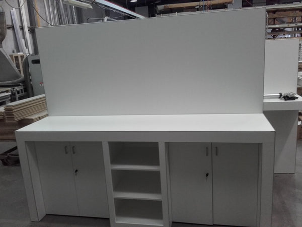 Large custom display unit with storage cupboards underneath