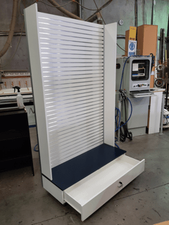 Custom free standing narrow tall slatwall display wall with shelf underneath 