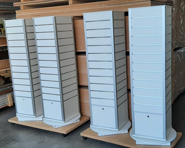 four rotating box tower display stands with plinths at the warehouse