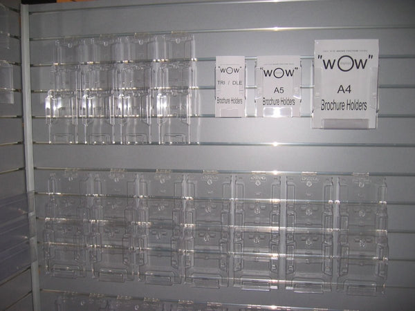 Stacked tiered brochure holders wall or desk mounted clear acrylic showing multi-brochure display setup
