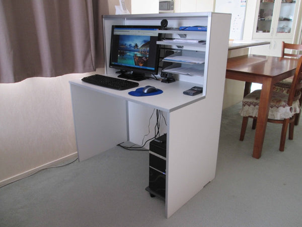 Small white reception desk in an office setting