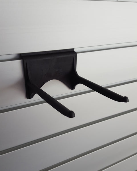 120mm Implement bracket shown here installed on Plankwall slatwall providing wall storage for tools, ladders, and equipment 