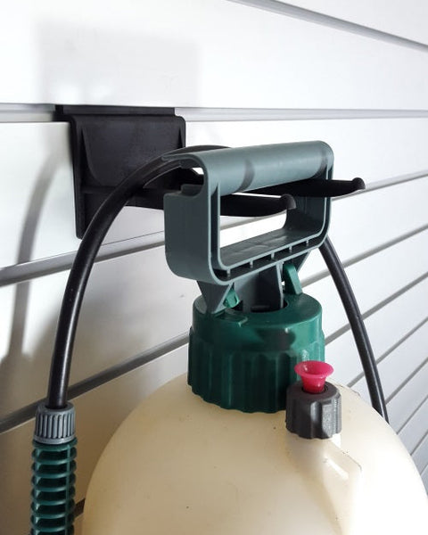 Plankwall implement brackets used for organised wall storage in retail, workshop, or garage settings