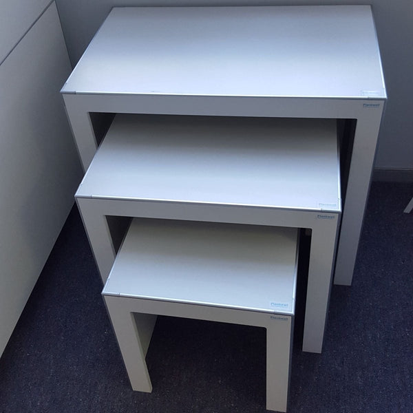 close up of 3x Plankwall nesting display tables in office. no decorations.