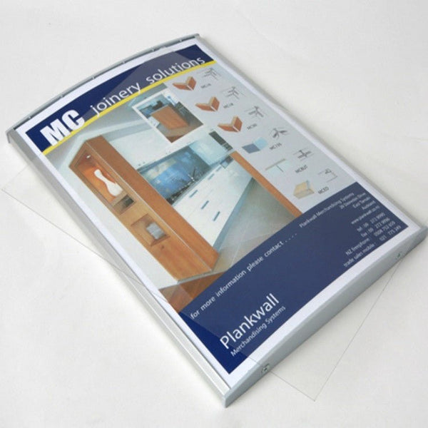 Plankwall radius poster frame mounted on slatwall, used for clean retail signage and header display in modular shopfit-out systems.