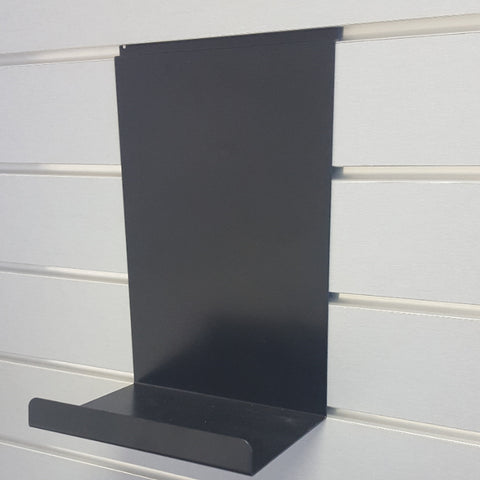 Plankwall structured display shelf organising small retail products in clean rows on a slatwall system.