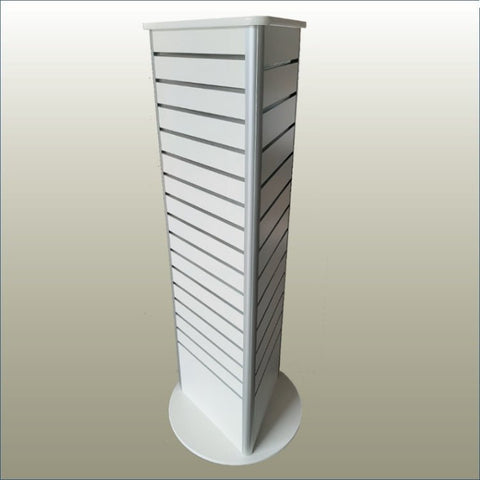 A white, three-sided, free-standing retail display unit with slatwall grooved panels and a circular base.