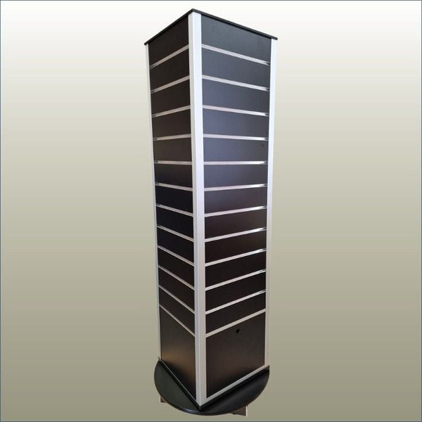 shown here is a four-sided rotating slatwall display stand in black with plinth and hidden storage on a gold background