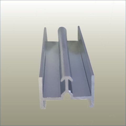 close up photo of the Plankwall anodised aluminium door track component. Designed to work with a black door track filler, both components are designed to hold sliding doors in place on a flat surface.