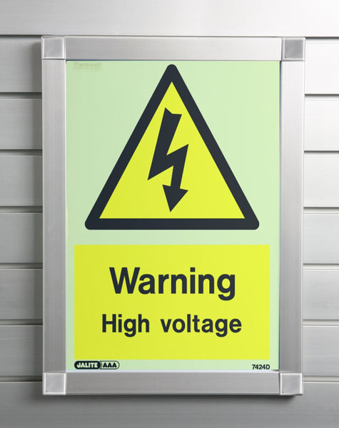 A  Plankwall aluminium snap frame displaying a warning sign at a business mounted on a slatwall wall panel. 