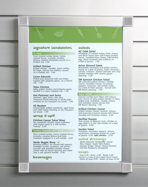 A  Plankwall aluminium menu snap frame displaying a menu on a slatwall wall panel. 