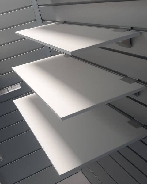 Side profile of the 9mm melamine shelf showing thickness and PVC edge tape on a Plankwall display wall.
