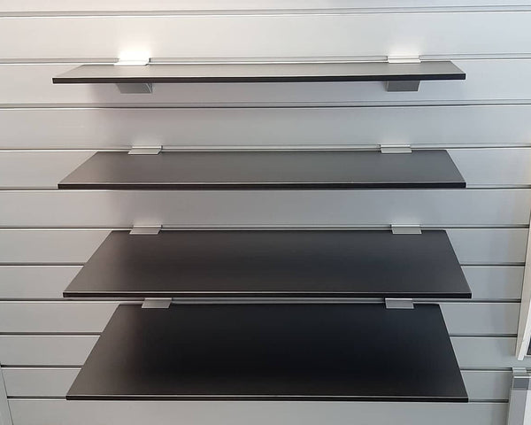 9mm melamine black shelf in front view with pvc edge tape and asb brackets mounted on slatwall
