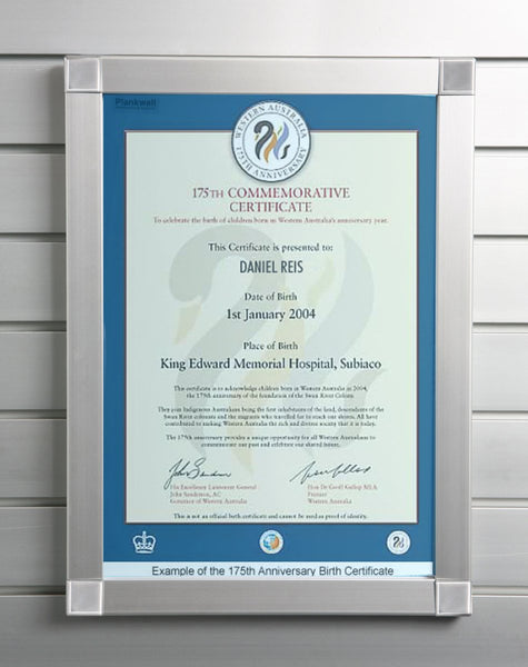 A  Plankwall aluminium snap frame displaying a certificate mounted on a slatwall wall panel