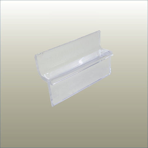Plankwall PC2 clear slatwall clip used to attach flat accessories with permanent adhesive to slatwall panels for clean retail displays