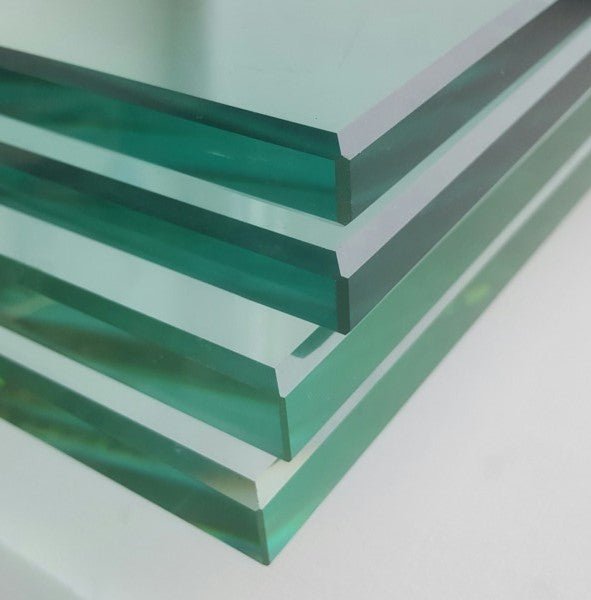 close-up of polished bevelled edged glass shelves 