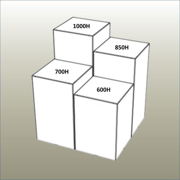 Tall retail display cubes in stepped heights creating layered merchandising display in modern retail interior with dimensions shown here.
