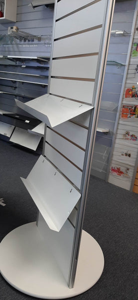 example of white sloping shelves attached to slatwall with 25 degrees and 60 degrees shelf brackets.